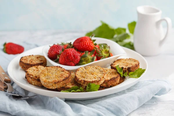 Vegan breakfast sweet tofu fritters (pancakes) with strawberries