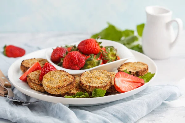 Vegan breakfast sweet tofu fritters (pancakes) with strawberries