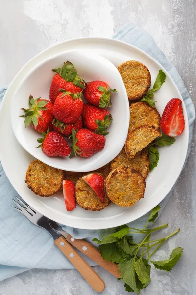 Vegan sweet tofu fritters with strawberries, top view.