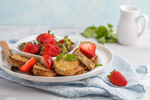 Vegan breakfast sweet tofu fritters (pancakes) with strawberries