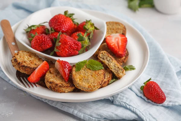 Vegan breakfast sweet tofu fritters (pancakes) with strawberries