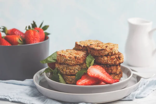 Vegan sweet tofu fritters (pancakes) with strawberries.