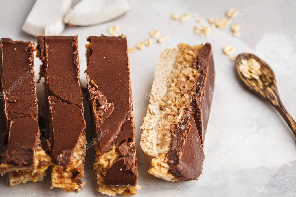 Coconut-oat raw vegan bars. Top view, light background