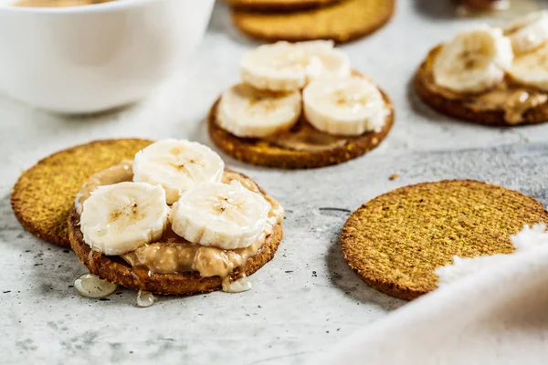 Crispbread with peanut butter, banana and honey. Vegan food