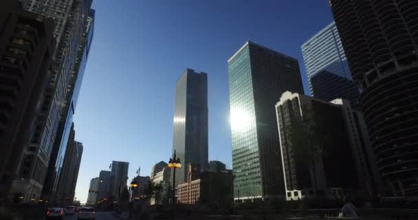Smooth, low angle tracking shot, taken from a car, as it rides down the Chicago — Stock Video