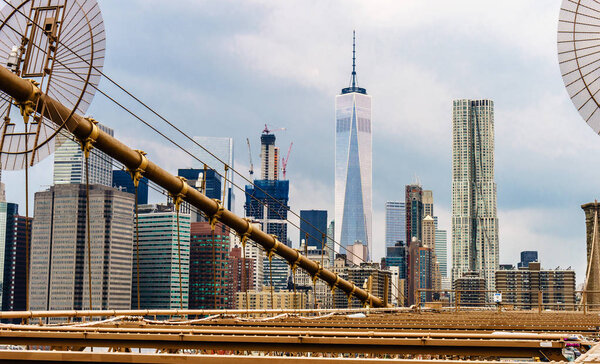Brooklyn Bridge across East River to Low Manhattan New York