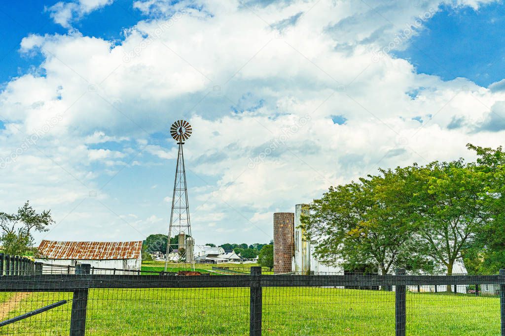 Amish Country, Lancaster PA US - September 4 2019,house, fence, tree, grass on the road between the fields in Lancaster, PA US