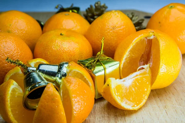 Fresh orange with Christmas toys on gray background 1 — Stock Photo, Image