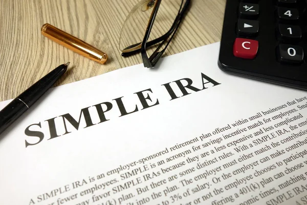 Simple ira document with pen calculator and glasses