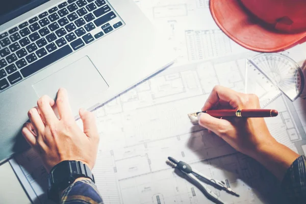 Architect or engineer working in office on blueprint. Architects — Stock Photo, Image