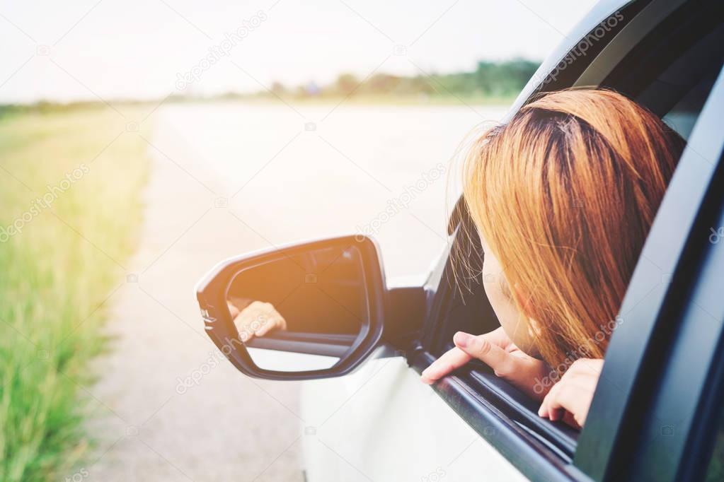 Asain woman traveler with  car on Beautiful road