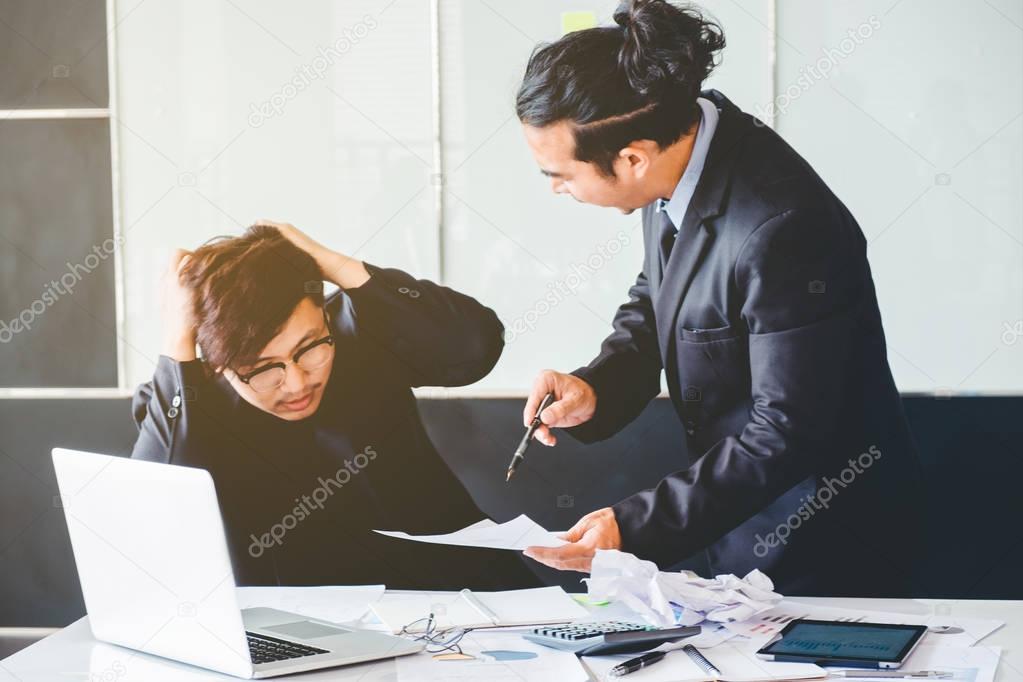 Asian Bad angry boss yelling at business man sad depressed emplo