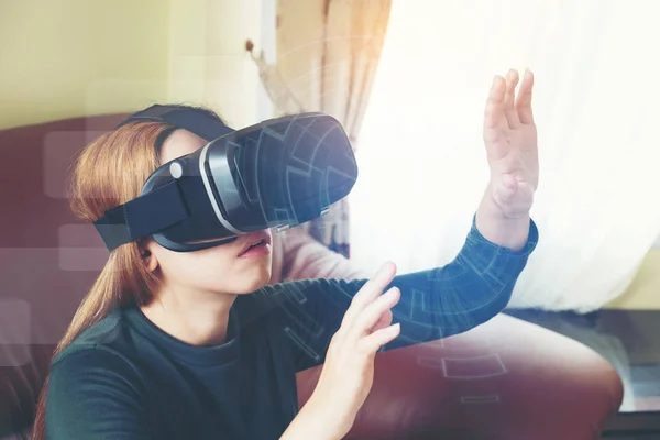 Woman Using 3-D glasses in virtual reality glasses or headset