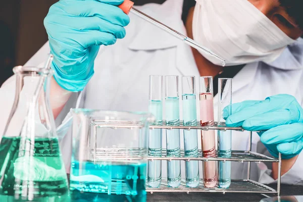 Scientist with equipment holding tools during scientific experim — Stock Photo, Image