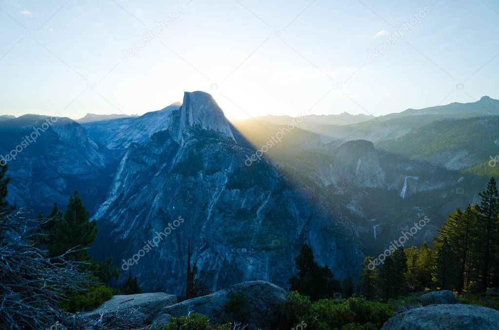 Half Dome in Yosemite National Park getting lit by sunrise light