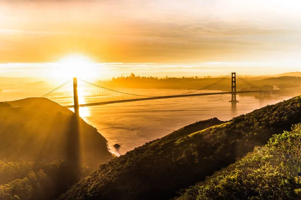 Golden Gate Bridge lit by first sun rays