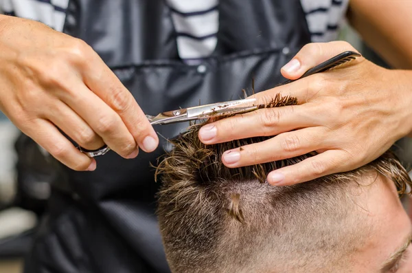 men's hair cutting scissors in a beauty salon