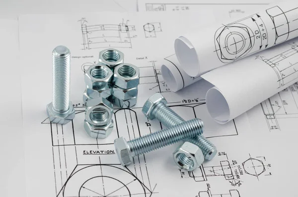 Mechanical Engineering Technology. Nuts and bolts on paper drawings — Stock Photo, Image