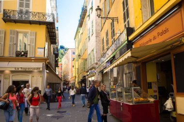 Nice, France - April 18 2017. Old town of Nice, A lot of tourists, patisseries and restaurants.  clipart