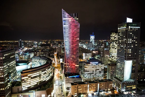 stock image Warsaw, Poland - 15 November 2018. Warsaw business center at night. View from Palace of culture and science. Business center light up in colors of Polish flag. 