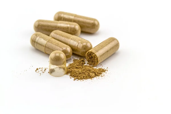 Herbal capsule on white background. — Stock Photo, Image