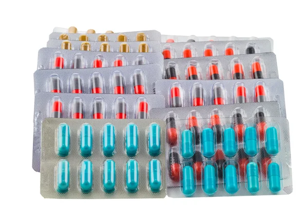 Painéis de empilhamento de pílulas, medicina oral isolada em fundo branco — Fotografia de Stock