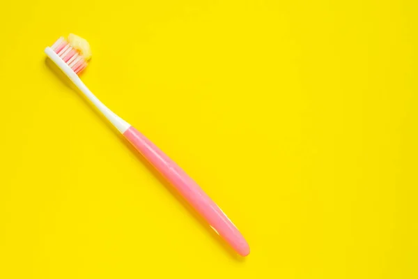 Bright pink and white tooth brush with paste. — Stock Photo, Image