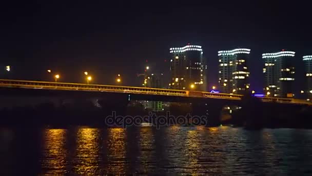 Cars going on the night bridge, view from below — Stock Video