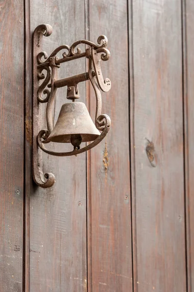 an old door bell on wooden background