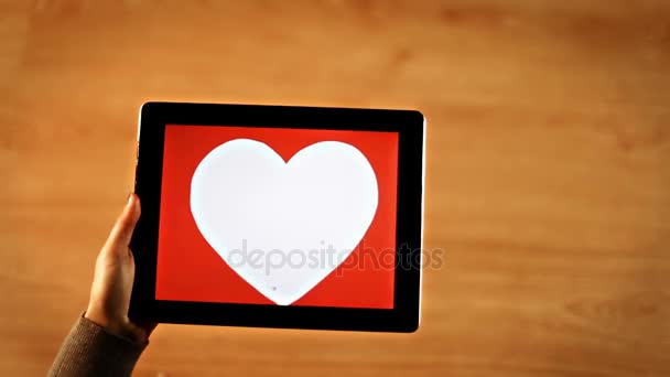 Love calligraphy. Female writing bold inside white heart on tablet — Stock Video