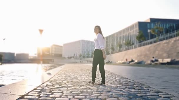 Beautiful girl walking near Spree river at Sunset — Stock Video