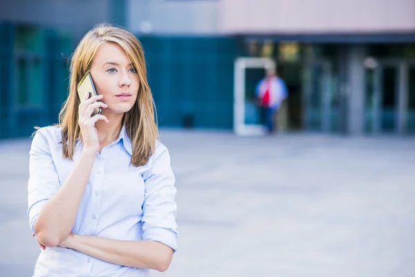 Photo of smart businesswoman calling somebody by mobile telephone