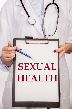 Doktor eller kelime cinsel sağlık gösterir. Tıp kavramı.
