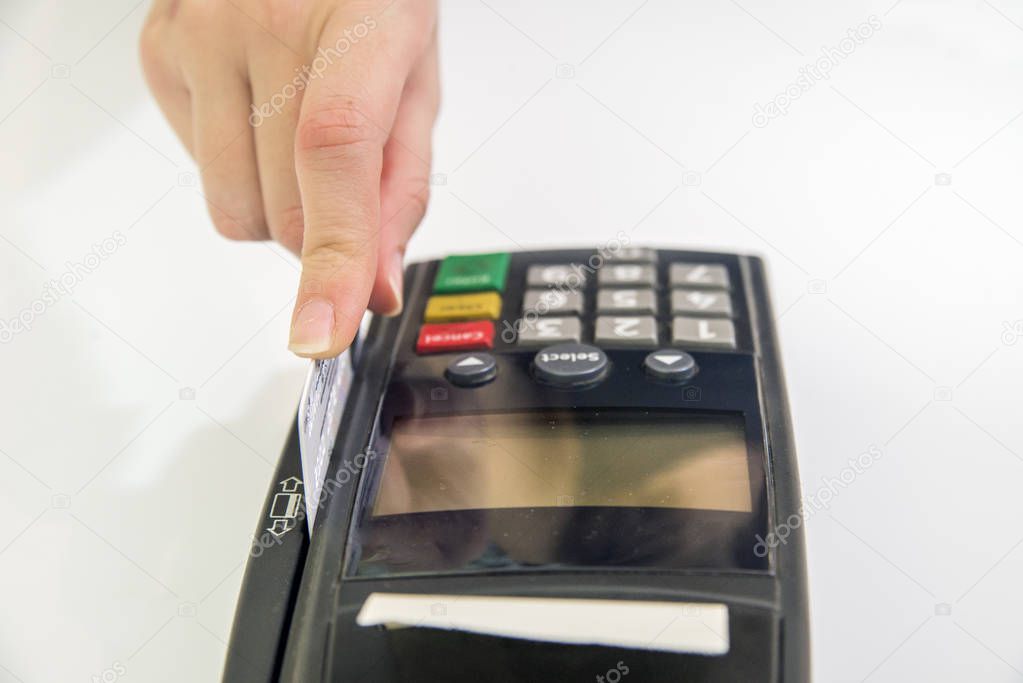 Female hand with credit card and bank terminal, Card machine or  pos terminal with inserted blank white credit card isolated on white background