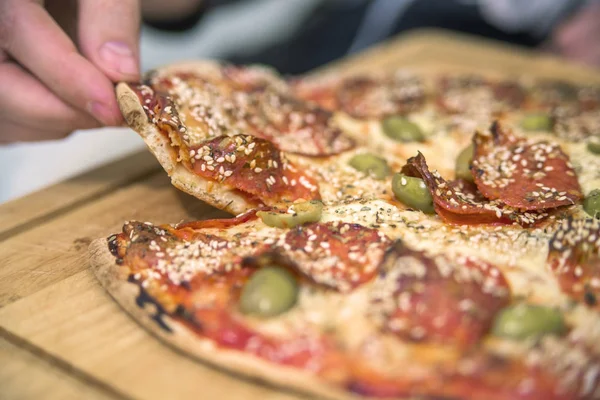 Eating Pizza. Group Of Friends Sharing Pizza Together. People Hands Taking Slices Of Pepperoni Pizza. Fast Food, Friendship, Leisure, Lifestyle.