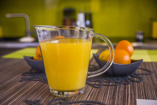 Orange juice in pitcher and oranges. healthy eating, food, dieti — Stock Photo, Image