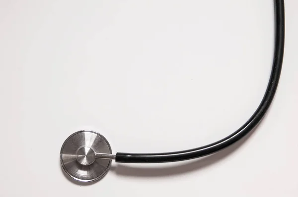 Close up view of black stethoscope on white back — Stock Photo, Image
