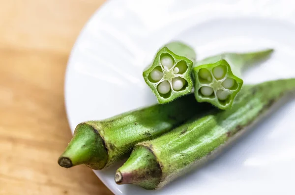 Fresh okra in white dish — Stock Photo, Image