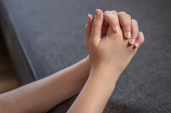 Praying woman hands.