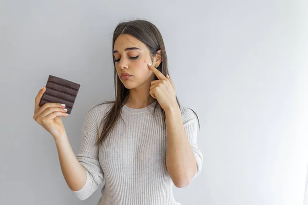 Young Woman Acne Problem Holding Chocolate Bar Grey Background Skin — Stock Photo, Image