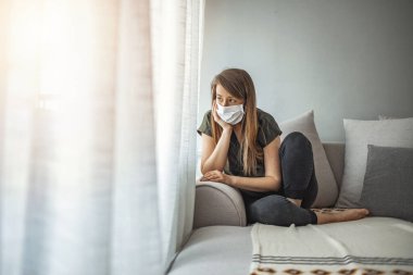 Woman in isolation at home for virus outbreak. Young woman in isolation at home for coronavirus. Woman in Isolation Quarantine Coronavirus. Sad lonely girl isolated stay at home clipart