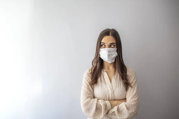 Girl with mask to protect her from Corona virus. Corona virus pandemic. Girl with medical mask to protect her from virus. People hospitalized, diagnosed, in carantine (isolation)