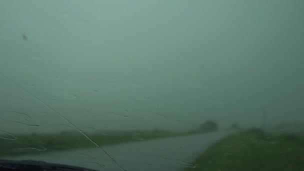 Foul Weather on Road, Storm Warning, the Driver Waits Bad Weather in the Car, the Wiper Can Not Cope With the Rain — Stock Video