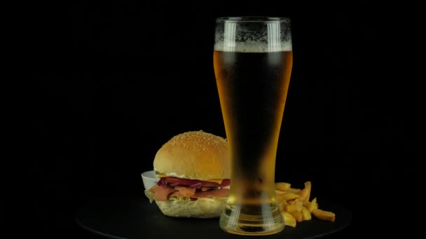 Big tasty Burger with red fish and beer — Stock Video