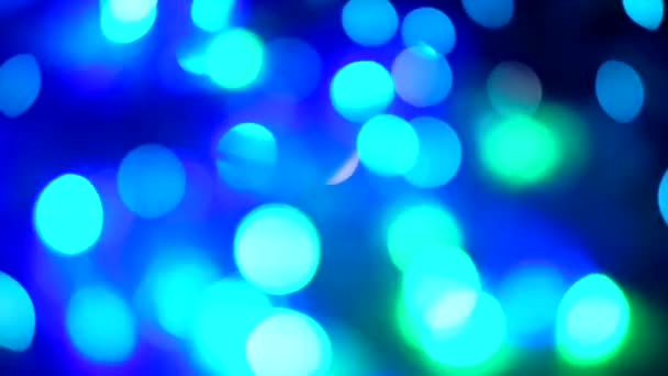 Abstract blurred of colored glittering shine bulbs lights on black background. — Stock Video