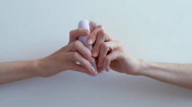Female with a comb and problem hair on white background.
