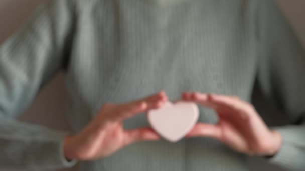 Soap in the shape of a heart in a girls hand. — Stock Video