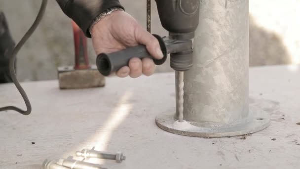 Drilling hole in concrete with hammer drill — Stockvideo