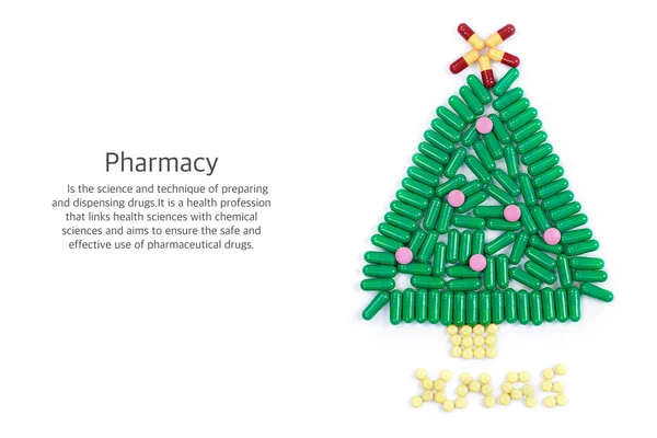 Tablets in form of Christmas tree and words under it — Stock Photo, Image