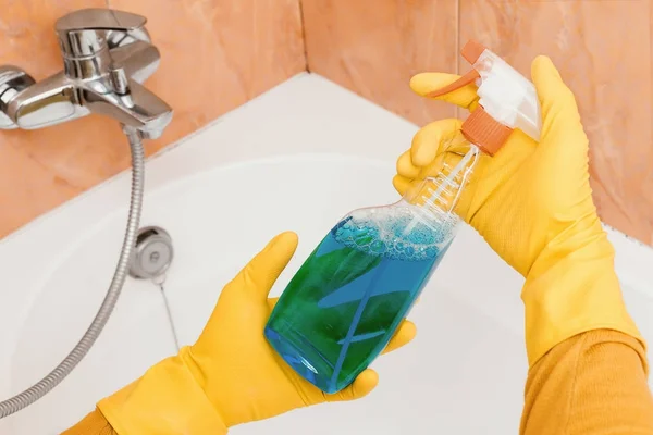 Cleaner holds the detergent from the mold in the bathroom — Stock Photo, Image